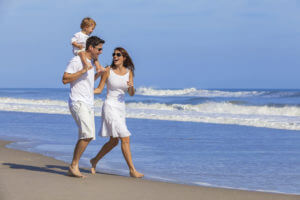 family-on-beach-wearing-white-clothes
