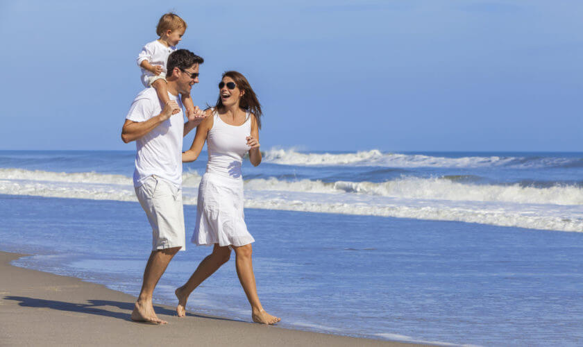 family-on-beach-wearing-white-clothes