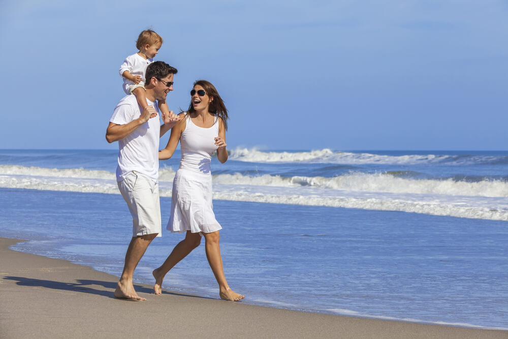 family-on-beach-wearing-white-clothes